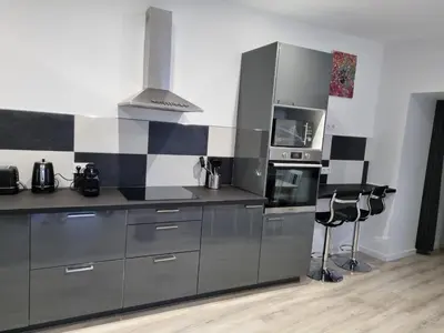 Cuisine ou kitchenette dans l'établissement Au Petit Ronceraie