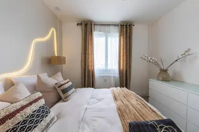 Un ou plusieurs lits dans un hébergement de l'établissement CineHome - 5 min Tours centre-Parking/Tram au pied