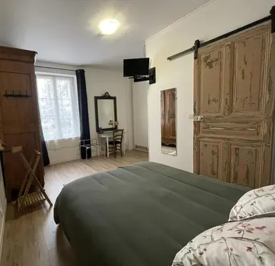 Un ou plusieurs lits dans un hébergement de l'établissement Aux Chambres des Dames