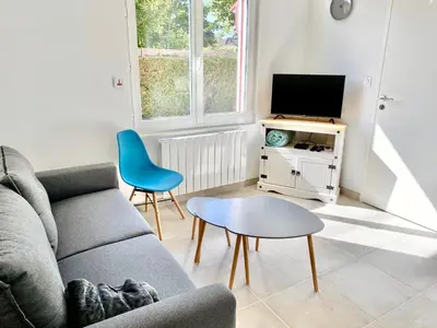 Télévision ou salle de divertissement dans l'établissement L'Escale l'Escapade Intervalle