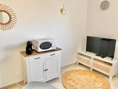 Télévision ou salle de divertissement dans l'établissement L'Escale l'Escapade Intervalle