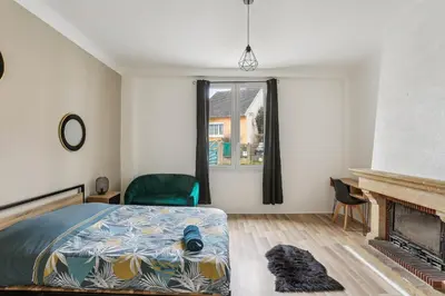 Un ou plusieurs lits dans un hébergement de l'établissement Appartement Neuf Proche Circuit 24h