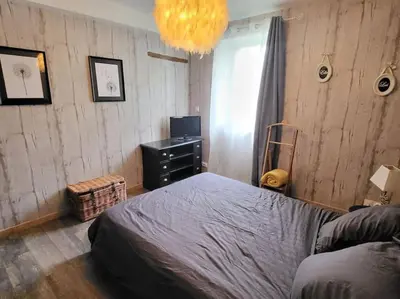 Un ou plusieurs lits dans un hébergement de l'établissement Le Cosy de la Fanière