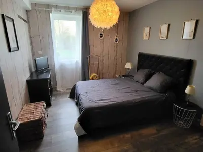 Un ou plusieurs lits dans un hébergement de l'établissement Le Cosy de la Fanière