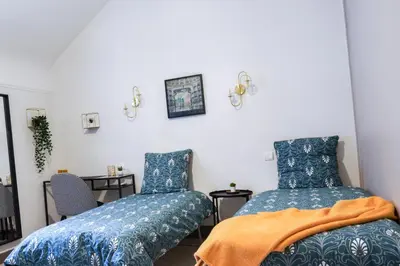 Un ou plusieurs lits dans un hébergement de l'établissement La Cour de l'Opera - PrestiPlace Collection