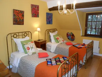 Un ou plusieurs lits dans un hébergement de l'établissement B&B La Ferme des Bordes