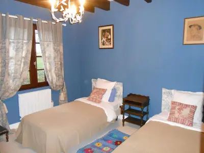 Un ou plusieurs lits dans un hébergement de l'établissement B&B La Ferme des Bordes