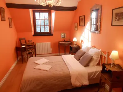 Un ou plusieurs lits dans un hébergement de l'établissement B&B La Ferme des Bordes