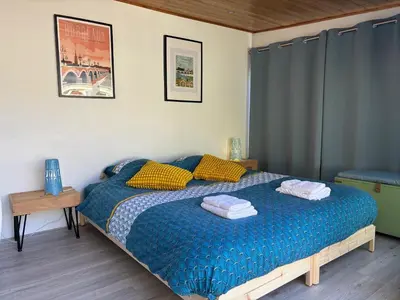 Un ou plusieurs lits dans un hébergement de l'établissement Le Troglogite Mignon - Maison et Jardin