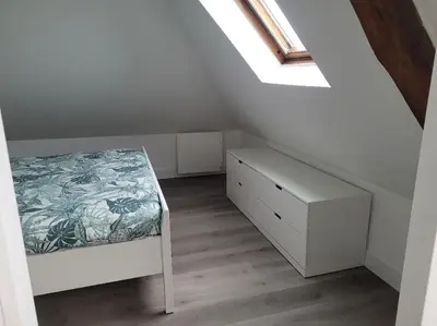 Un ou plusieurs lits dans un hébergement de l'établissement Appartement avec vue sur Loire