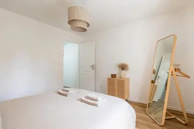 Un ou plusieurs lits dans un hébergement de l'établissement Chaleureuse maisonnette