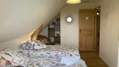 Un ou plusieurs lits dans un hébergement de l'établissement Simples Escales : gîte nature, détente et sauna