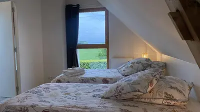 Un ou plusieurs lits dans un hébergement de l'établissement Simples Escales : gîte nature, détente et sauna