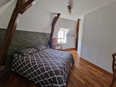 Un ou plusieurs lits dans un hébergement de l'établissement Les Chambres de Beaumont