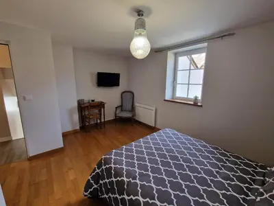 Un ou plusieurs lits dans un hébergement de l'établissement Les Chambres de Beaumont