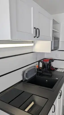 Cuisine ou kitchenette dans l'établissement Studio Volta Garden proche du tram