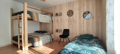 Un ou plusieurs lits dans un hébergement de l'établissement Appartement 2 chambres avec WIFI Centre de Descartes