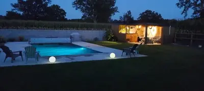 Piscine de l'établissement Chambres dans maison campagne circuit LE MANS ou située à proximité