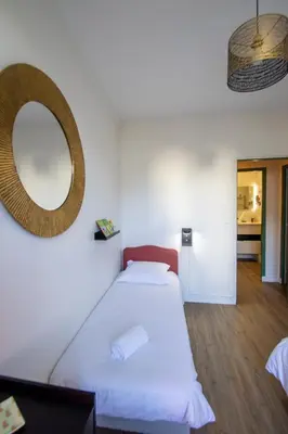 Un ou plusieurs lits dans un hébergement de l'établissement Home de Vitruve