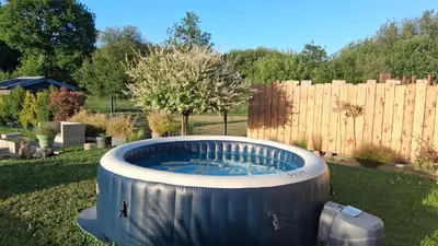 Jardin de l'établissement Maison 170m2 entre ville et campagne