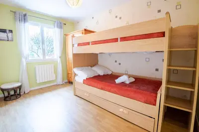 Un ou plusieurs lits dans un hébergement de l'établissement Le Sapin Parasol - House for 7 people.
