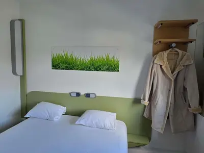 Un ou plusieurs lits dans un hébergement de l'établissement Ibis Budget Angers Parc des Expositions