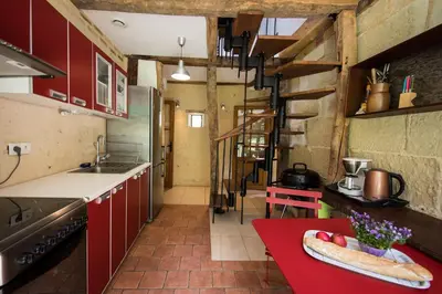 Cuisine ou kitchenette dans l'établissement Holiday home Le Vaugarnier