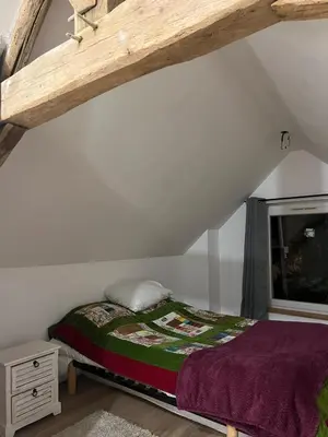 Un ou plusieurs lits dans un hébergement de l'établissement Moonlight cottage france