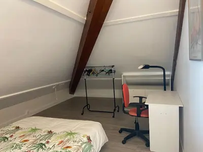 Un ou plusieurs lits dans un hébergement de l'établissement Appartement en résidence avec parking