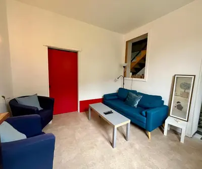 Coin salon dans l'établissement Maison - La campagne près de la ville