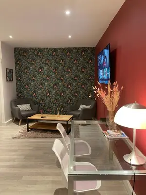 Télévision ou salle de divertissement dans l'établissement Le Relais Du Petit Lion