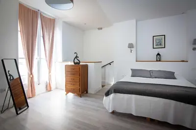 Un ou plusieurs lits dans un hébergement de l'établissement Le Relais Du Petit Lion