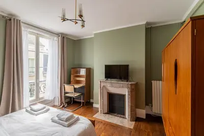 Un ou plusieurs lits dans un hébergement de l'établissement Villa du Loir