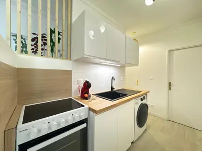 Cuisine ou kitchenette dans l'établissement De Gaulle - Parade 24h - Parking - 6 pers