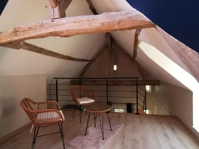Coin salon dans l'établissement Gîte de charme avec terrasse, proche circuit 24H et zoo de la Flèche, idéal pour 4 pers. - FR-1-410-438