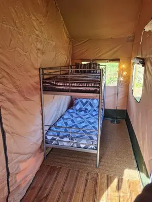 Un ou plusieurs lits dans un hébergement de l'établissement Camping de la touche