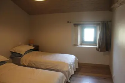 Un ou plusieurs lits dans un hébergement de l'établissement L'Écurie at Closerie Les Roches - Cozy 2 Bed Country Cottage