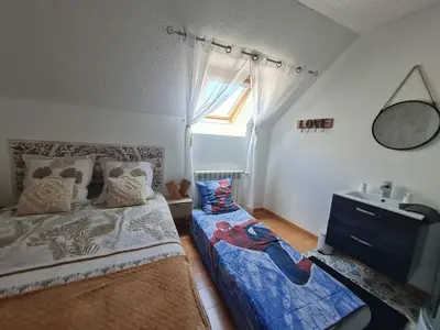 Un ou plusieurs lits dans un hébergement de l'établissement Chez Malia