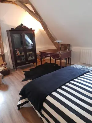 Un ou plusieurs lits dans un hébergement de l'établissement chambre d'hôtes dans un moulin du 16ème