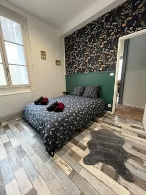 Un ou plusieurs lits dans un hébergement de l'établissement Au pied du château