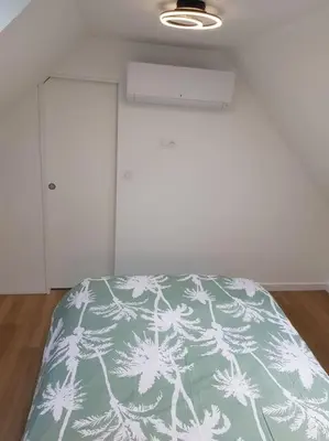 Un ou plusieurs lits dans un hébergement de l'établissement Maison de campagne à la ville