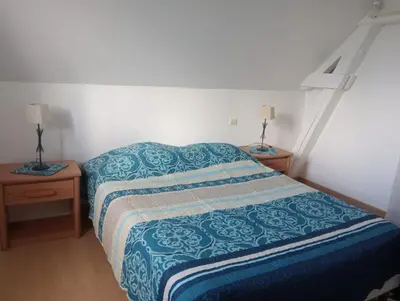 Un ou plusieurs lits dans un hébergement de l'établissement Maison de campagne