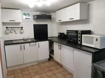 Cuisine ou kitchenette dans l'établissement studio rez-de-chaussée jusqu'à 4 personnes