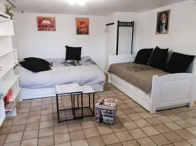 Un ou plusieurs lits dans un hébergement de l'établissement studio rez-de-chaussée jusqu'à 4 personnes