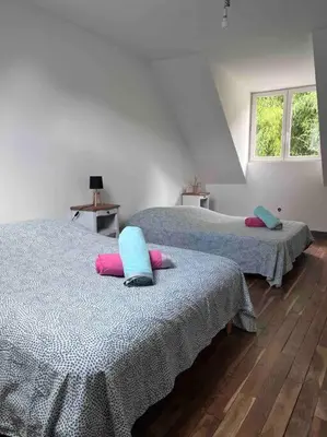 Un ou plusieurs lits dans un hébergement de l'établissement Vaste Maison à la campagne