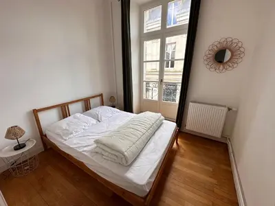 Un ou plusieurs lits dans un hébergement de l'établissement Appartement cœur de ville