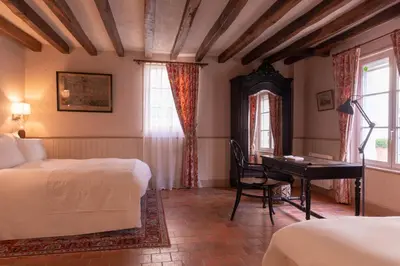 Un ou plusieurs lits dans un hébergement de l'établissement Le Domaine de Mestré, The Originals Relais