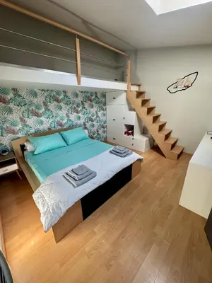 Un ou plusieurs lits dans un hébergement de l'établissement Chambre chez l'habitant avec piscine 400m Circuit 24h Le Mans
