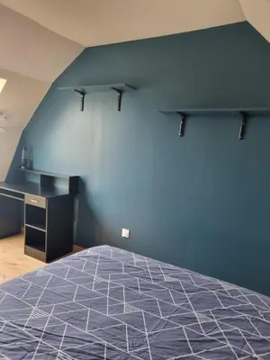 Un ou plusieurs lits dans un hébergement de l'établissement Chambres proches du circuit des 24 heures du Mans, au calme