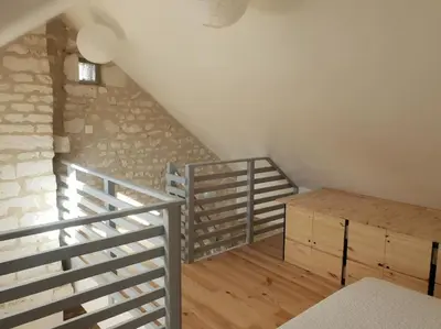 Un ou plusieurs lits dans un hébergement de l'établissement Guest house champêtre et lumineuse en tuffeau